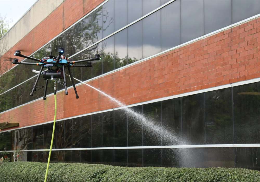 A drone cleaning a commercial building